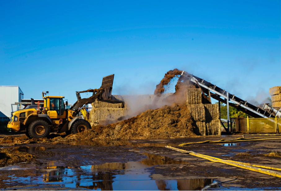Heavy machinery dumping soil