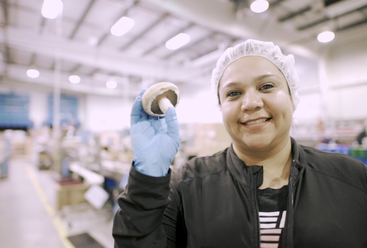 Woman holding mushroom